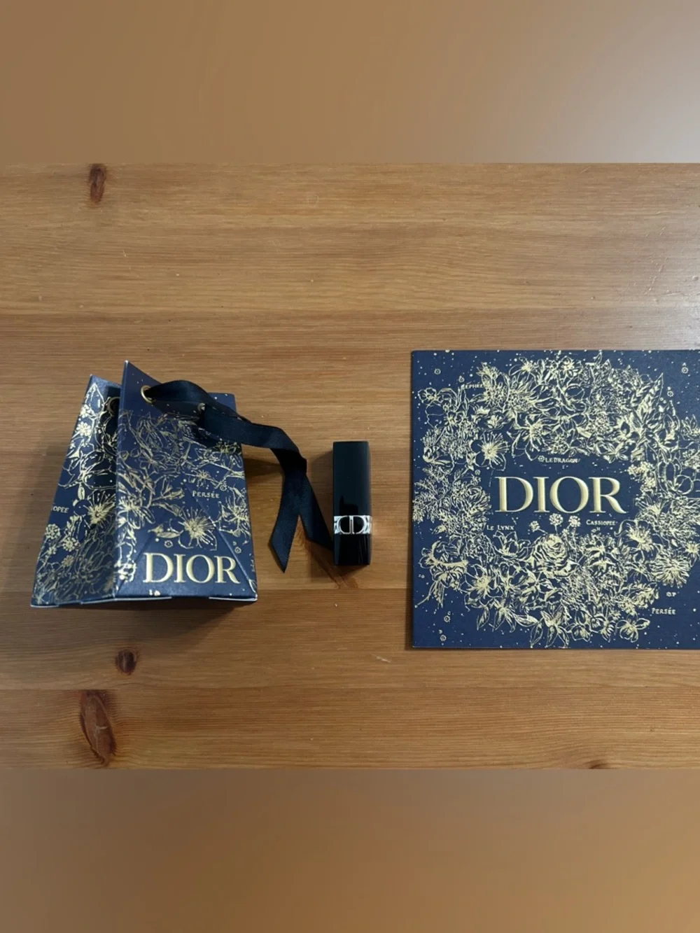 Dior rouge mini lipstick in SATIN 999 (red) with matching bauble and card